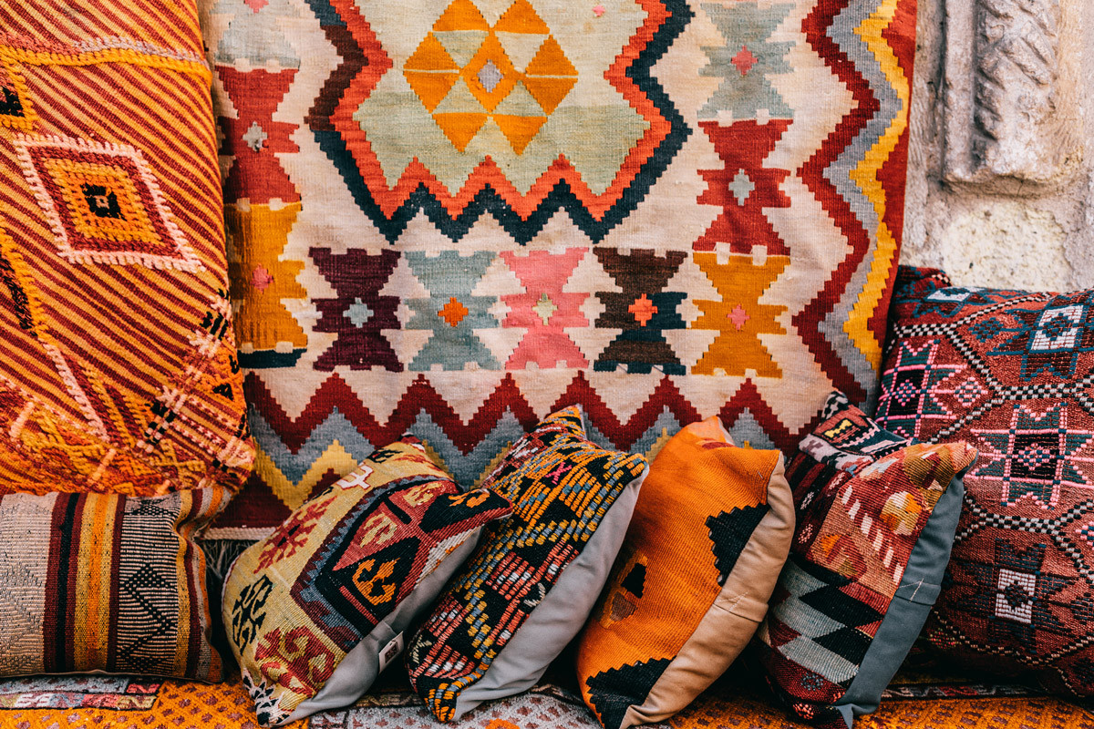 Bright patterned cushions at street market